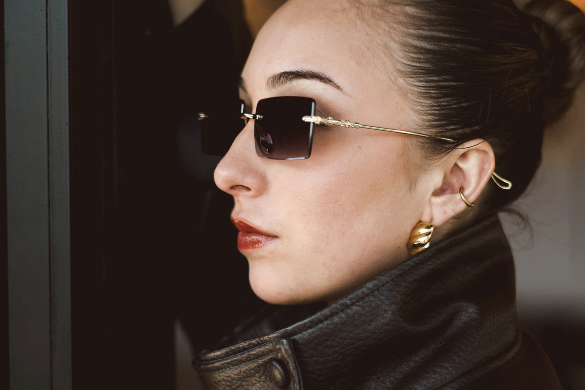 Amethyst rimless sunglasses worn