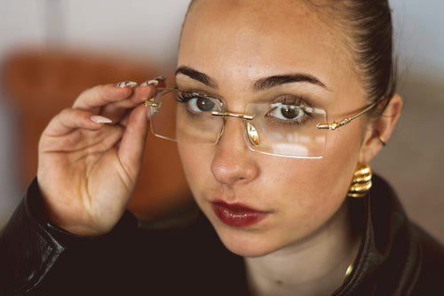 Crystal rimless sunglasses worn