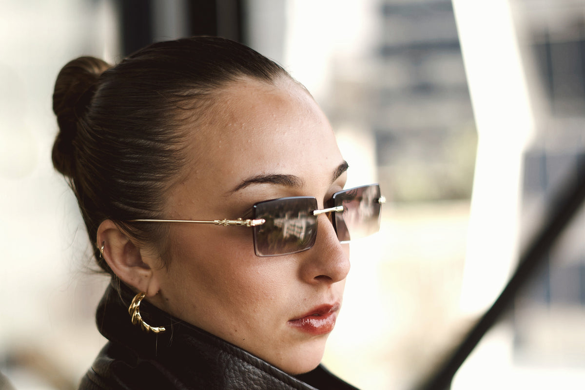 Amethyst rimless sunglasses worn