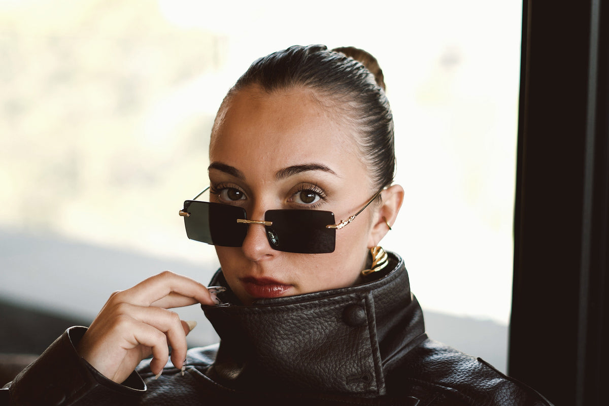 Obsidian rimless sunglasses worn