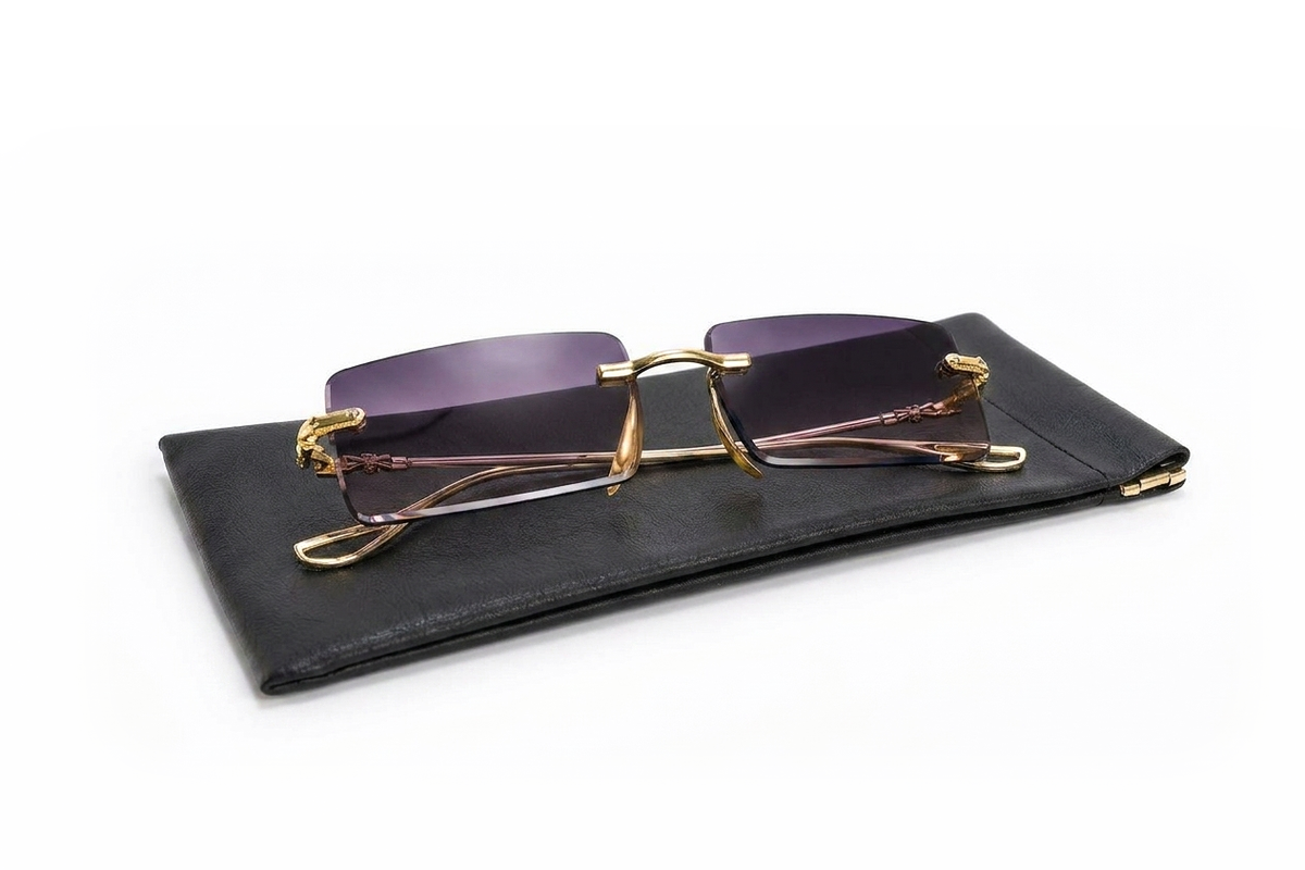 Amethyst rimless sunglasses on their leather pouch