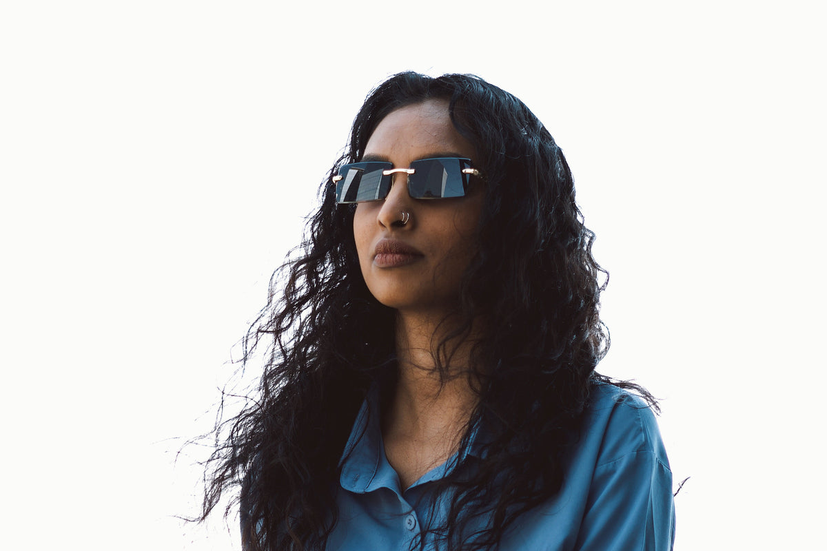 Obsidian rimless sunglasses worn