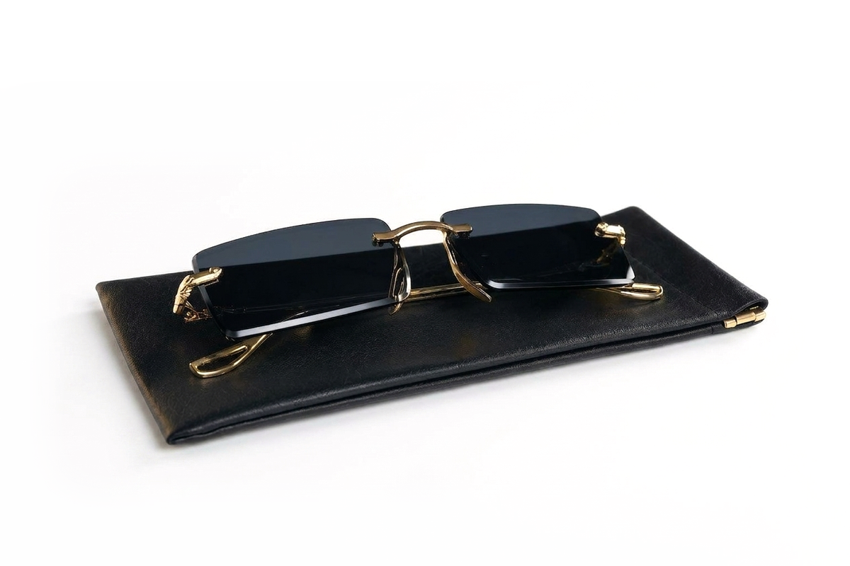 Obsidian rimless sunglasses on their leather pouch